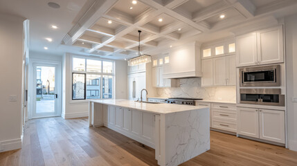 The spacious and bright modern kitchen features an island with marble countertop, white cabinets, and beautiful coffered ceiling with recessed lighting design.
