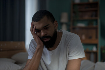 Portrait of african american male with pensive facial expression suffers from PTSD