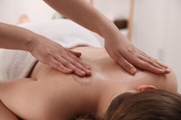 Cupping therapy. Woman receiving professional massage in spa salon, closeup