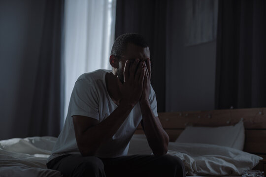 Depressed black guy suffers from mental illness episode staying alone at home