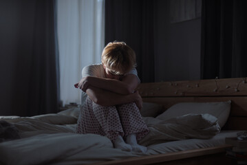 Woman suffers from family violence staying in bedroom