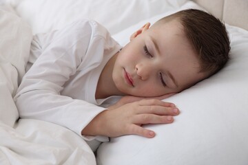 Bedtime. Cute boy sleeping in comfortable bed