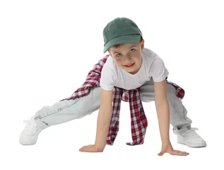 Fotobehang Happy little boy in baseball hat dancing on white background © New Africa