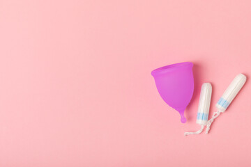 Menstrual cup on a bright background. Sanitary napkins, tampons and menstrual cup.Concept of...