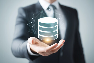 Businessman holding holographic database icon