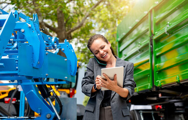 Female dealer multitasking at agricultural machinery dealership