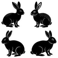 Fototapeta premium Four black rabbits in different poses with long ears and short tails on a white isolated background