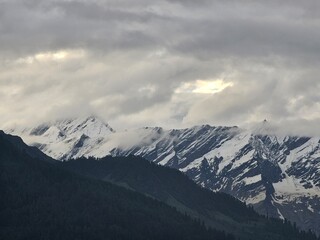 Zoomed in shot of Himalayan mountains and clouds