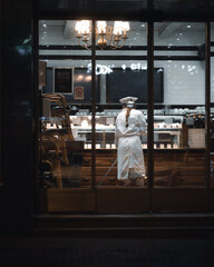 Woman cleaning at night in prague