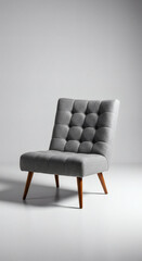 Obraz premium Mid-century modern lounge chair design with wooden legs and neutral-tone upholstery, captured in high-resolution on a seamless white background with realistic studio lighting and natural floor shadows