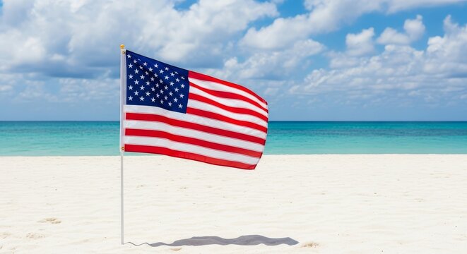American Flag Waving on a Pristine Beach Under a Blue Sky