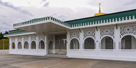 The Royal Mausoleum, Malay: Kubah Makam Diraja, features intricate architecture against a vibrant sunset, Located in Batu Satu, Bandar Seri Begawan, Brunei Darussalam