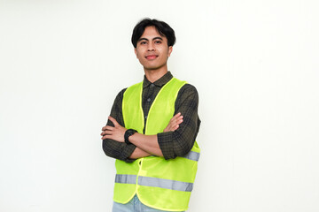 Confident Asian construction worker crossing arms and smiling at the camera on white background. Perfect for industrial, labor, or recruitment advertisement themes