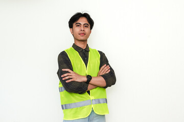 Confident Asian construction worker crossing arms and smiling at the camera on white background. Perfect for industrial, labor, or recruitment advertisement themes