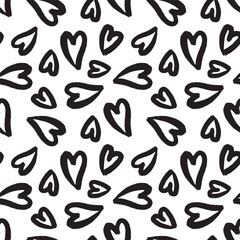 Vector hand drawn seamless pattern with black hearts on white background