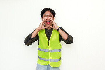 Portrait of an enthusiastic Asian construction worker making an announcement gesture, isolated on...
