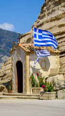 Small shrine and greek flag