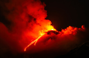 eruption of volcano during night ,  Night sky fire explosion burst flame smoke burning light glow...
