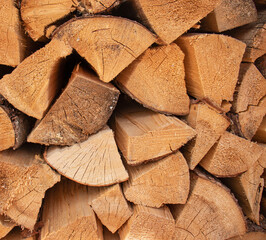 firewood background, Stack of freshly cut firewood logs arranged in a neat pile