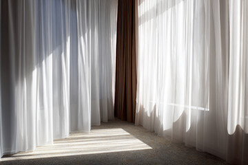 Obraz premium Soft sunlight filters through sheer white curtains in calm room, casting gentle shadows on carpeted floor and creating peaceful, serene atmosphere