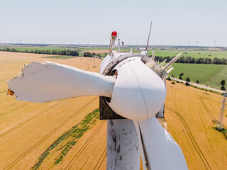 Weathered and broken wind turbine symbolizing energy risk