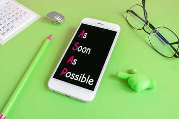 As soon as possible symbol. Concept words As soon as possible written on the mobile phone screen....