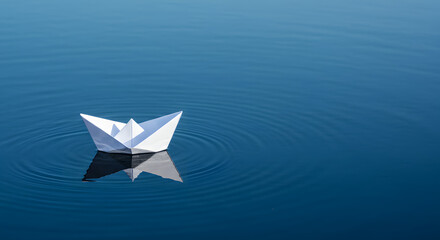 Paper Boat Floating on Calm Water