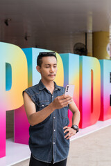 Portrait of confident non binary gay man during pride outdoors