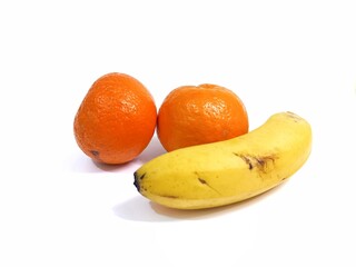 Fresh bananas and tangerines on white background