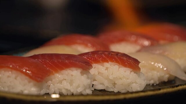 Close-Up of Aburi Sushi Torched with Bubbling Soy Glaze &ndash; Japanese Cuisine Flame-Cooked in Motion