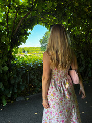 a woman out in the garden in a floral summer dress