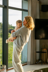 Hirtshals, Denmark A six-month old baby girl is held by her grandma.
