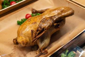 Delicious roast duck in the supermarket window