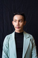 Obraz premium Portrait of nonbinary genderfluid young Asian gay man in studio