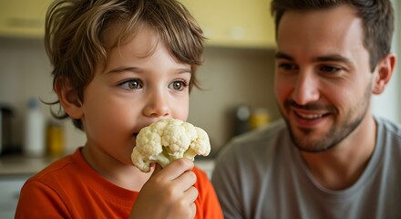 Happy Father and Son Bonding Over Healthy Food at Home