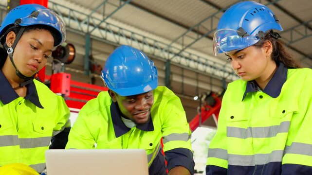 Workers or engineers meeting and talking about work and project in the robot factory