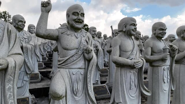 B-roll footage of Vihara Ksitigarbha Bodhisattva in Tanjung Pinang, featuring intricate stone carvings, serene Buddha statues, and the famous 500 life-sized arhats in a peaceful setting.