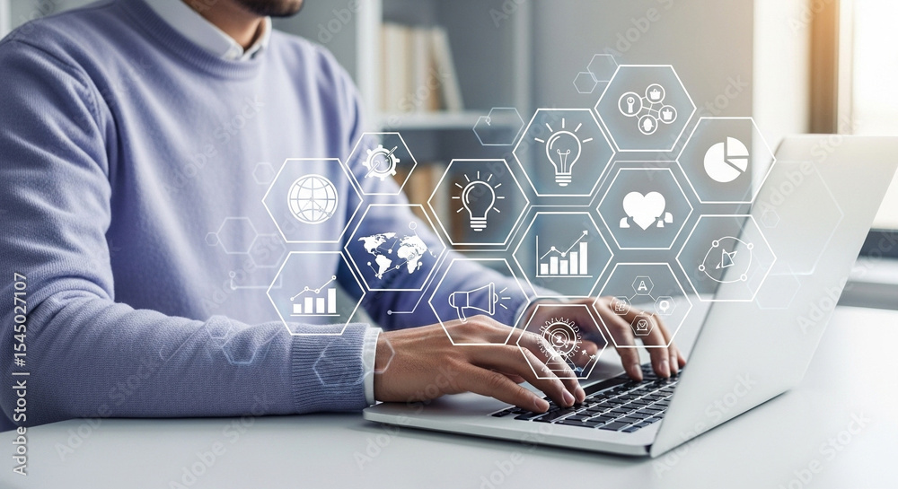 Poster man typing on laptop with digital icons overlaying the screen in a bright office setting indoors