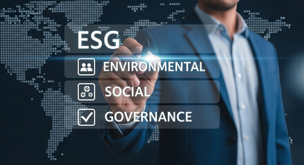 Man in suit pointing at esg factors environmental social governance on world map background display