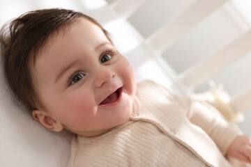 Bedtime. Cute little baby in crib at home