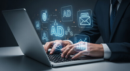 Person typing on laptop with digital marketing icons overlaying the screen and hands visible