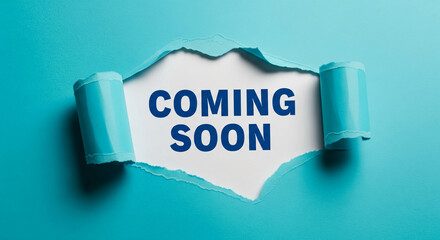 Torn turquoise paper reveals white space with "Coming Soon" in dark blue text, showcasing anticipation and a future announcement