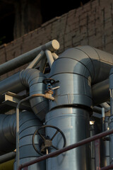 In a factory environment, a large number of pipes are interconnected with one another to facilitate...