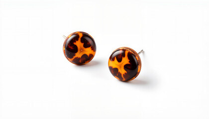 Tortoiseshell earrings displayed on isolated, transparent background  