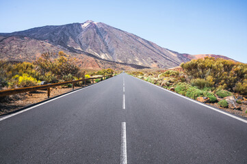 Scenic road stretches towards the iconic Mount Teide in Tenerife, Canary Islands, Spain