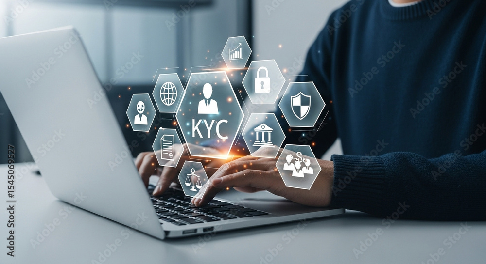 Poster Person typing on a laptop with kyc and security icons displayed above the keyboard in a digital overlay