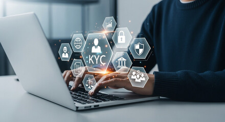 Person typing on a laptop with kyc and security icons displayed above the keyboard in a digital overlay