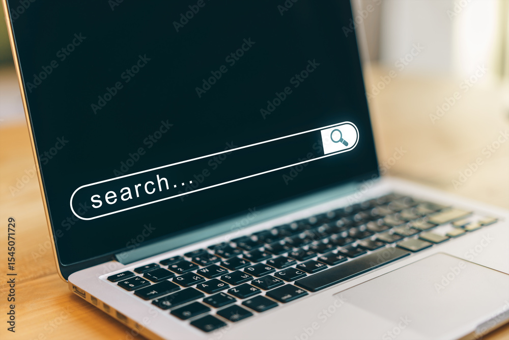 Poster closeup of laptop with digital search bar on screen in bright office setting, symbolizing online bro