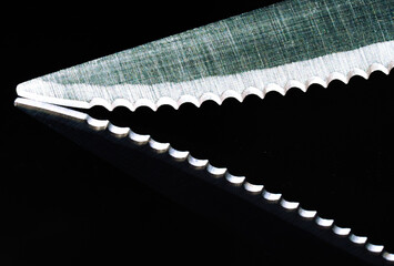 Macro texture of a serrated knife blade close-up photography kitchen environment high-detail...
