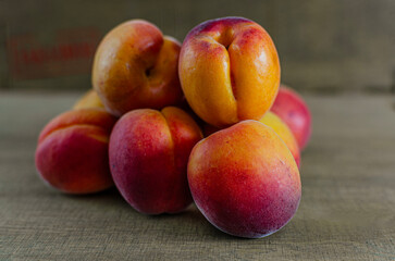 Fresh ripe apricots on a rustic wooden table